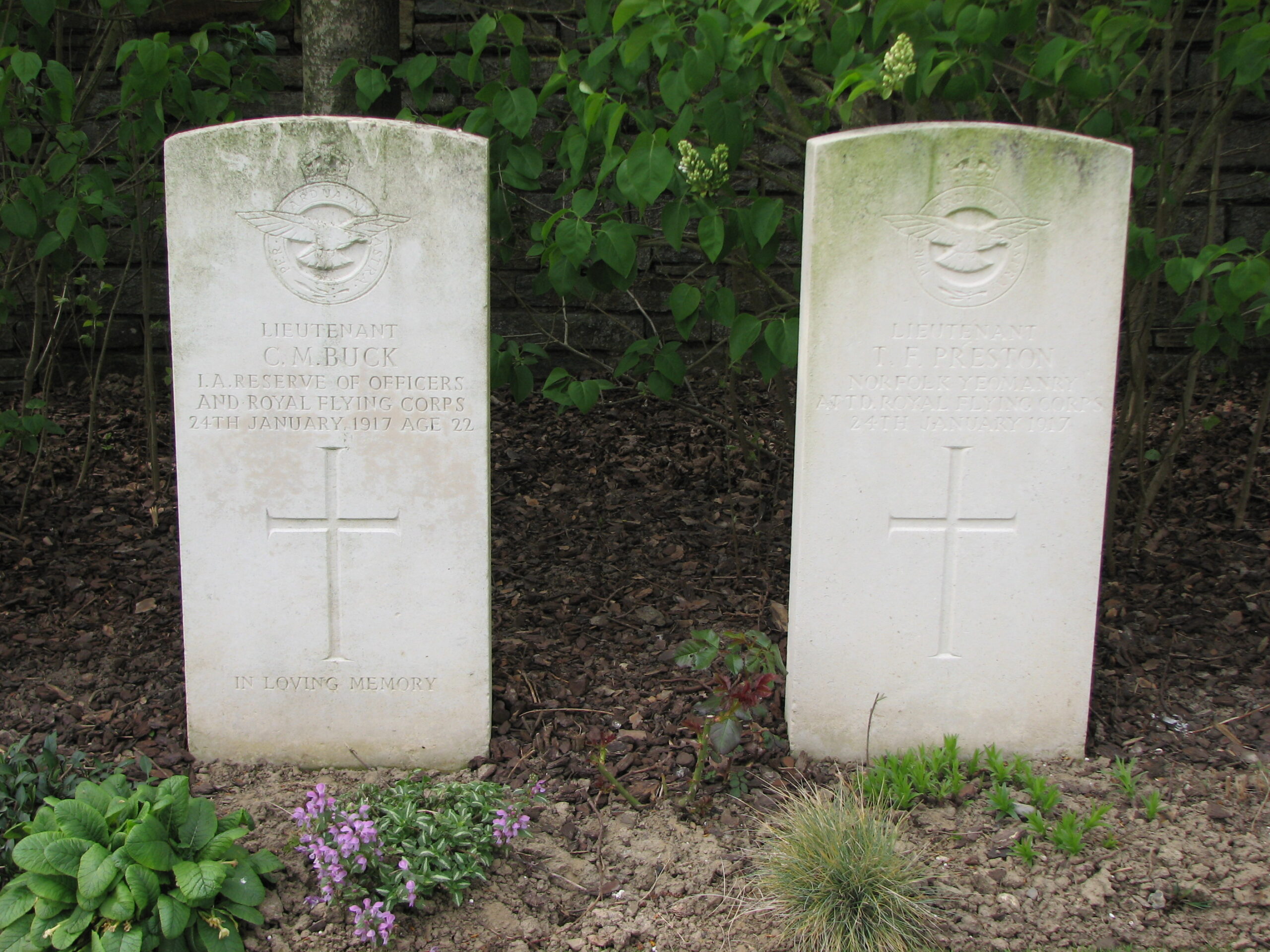 The headstones of Charles and his pilot, Thomas Preston, Oosttaverne Wood Cemetery<br>MA