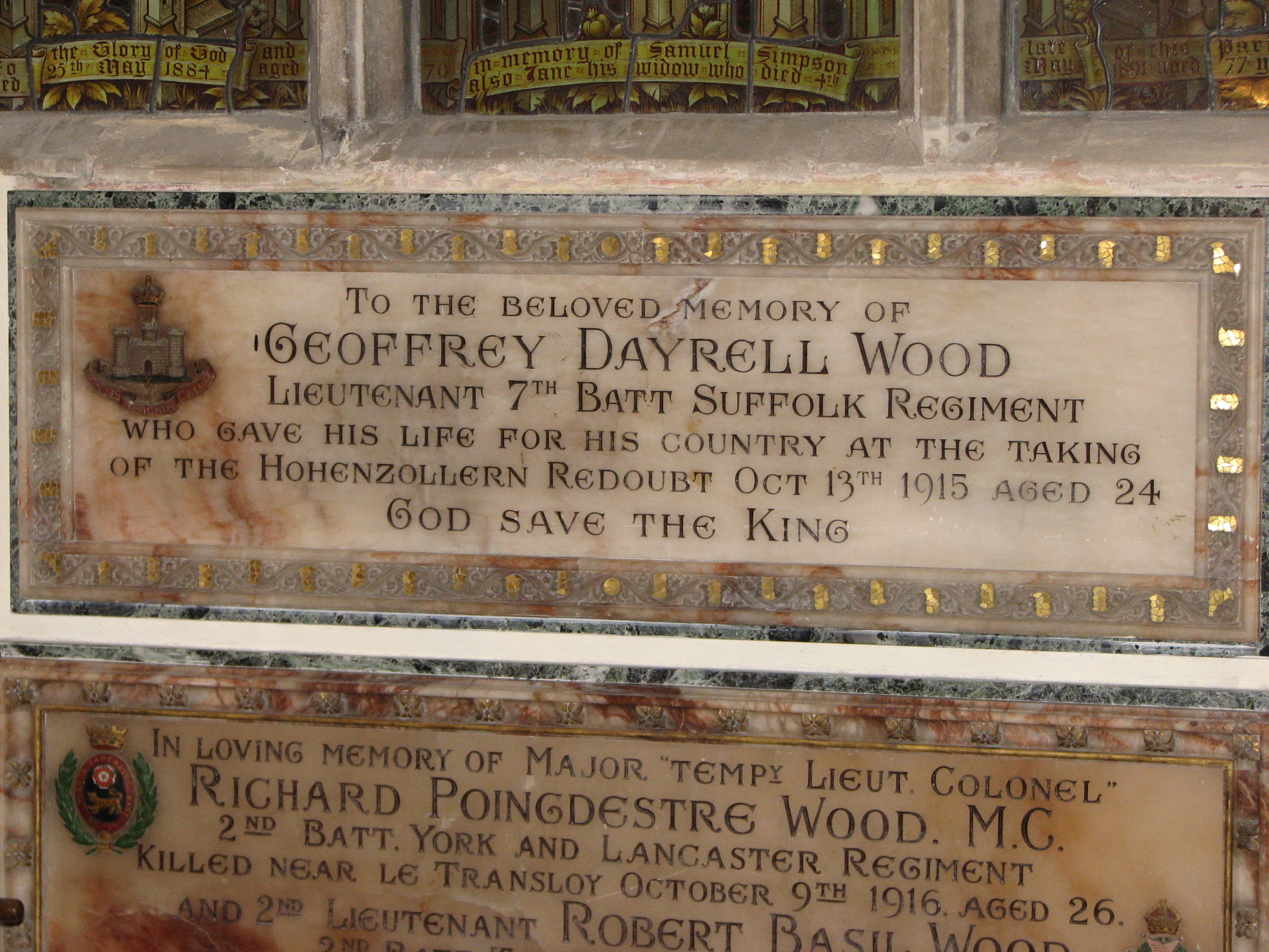 The memorial tablet to Geoffrey, erected by his parents on the South Wall of the Chancel  of St. Mary's Church<br>It incorrectly states that Geoffrey lost his life in the taking of the Hohenzollern Redoubt.  The Redoubt was actually a different  German defensive position approximately 1 km from the site of the 7th Suffolks attack at the Hulluch Quarries.<br />MA